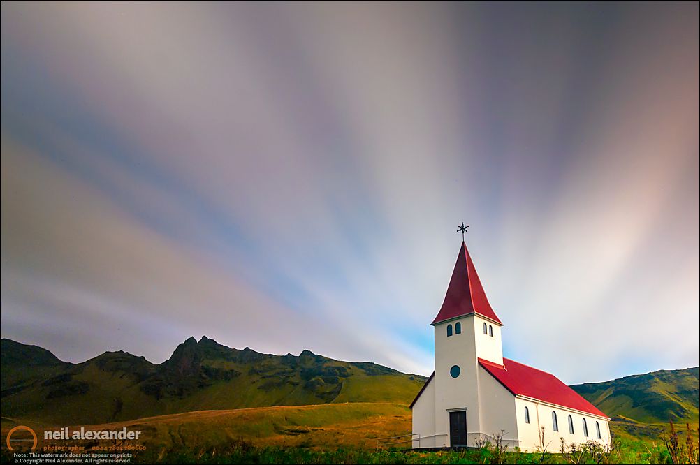 A 5 minute exposure of first light over the church at Vik in Iceland
