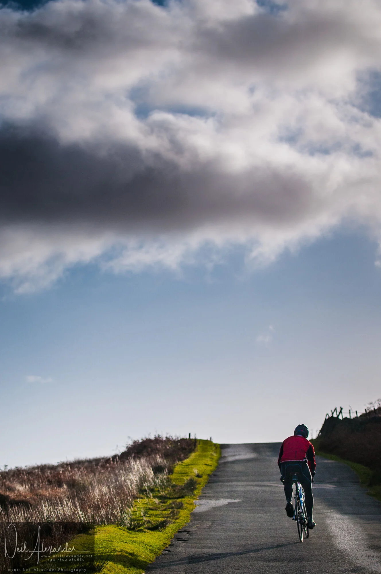 Cyclist struggling up New Road, Bamford-Neil_Alexander-06.jpg
