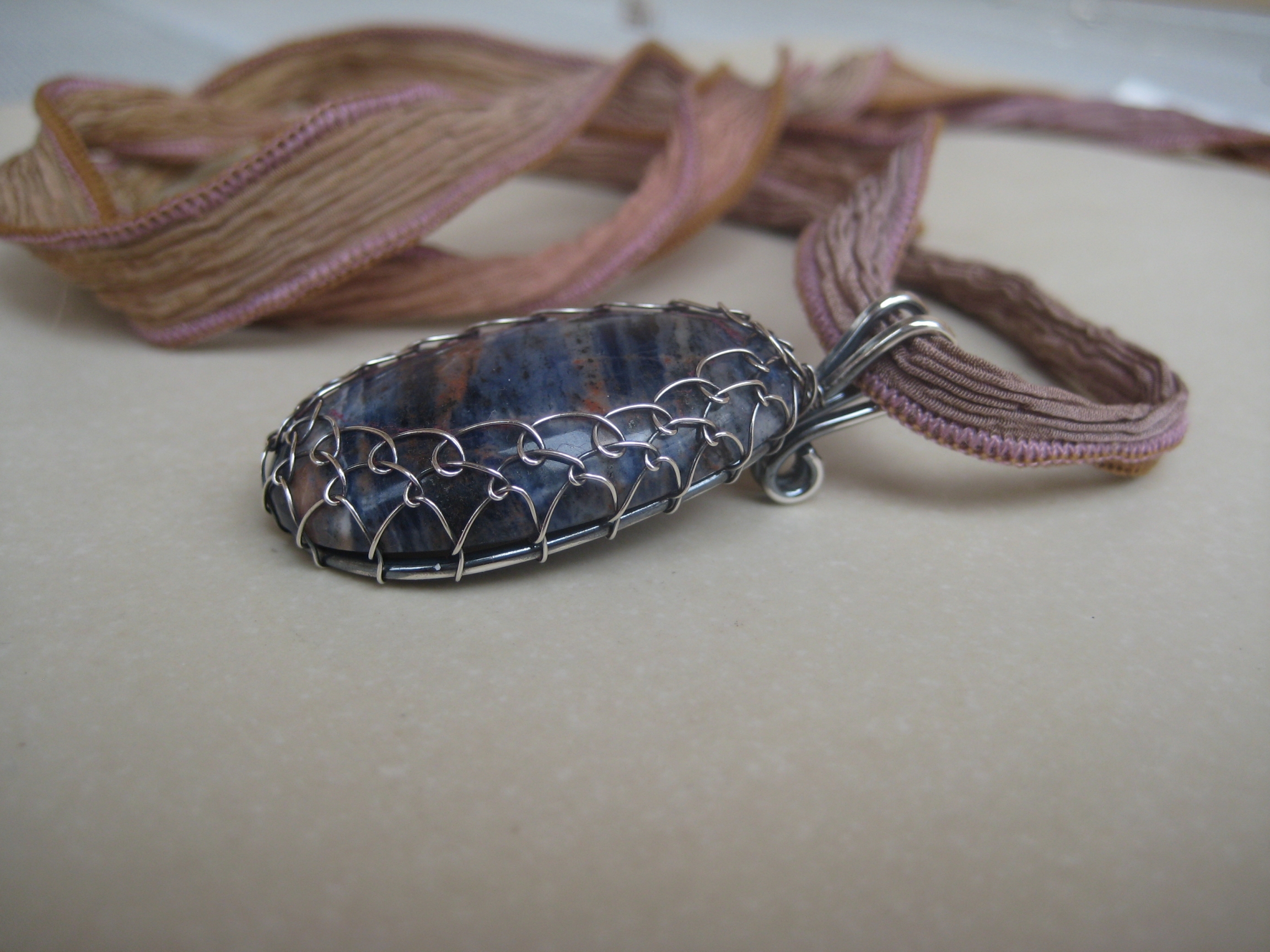 Sodalite on silk