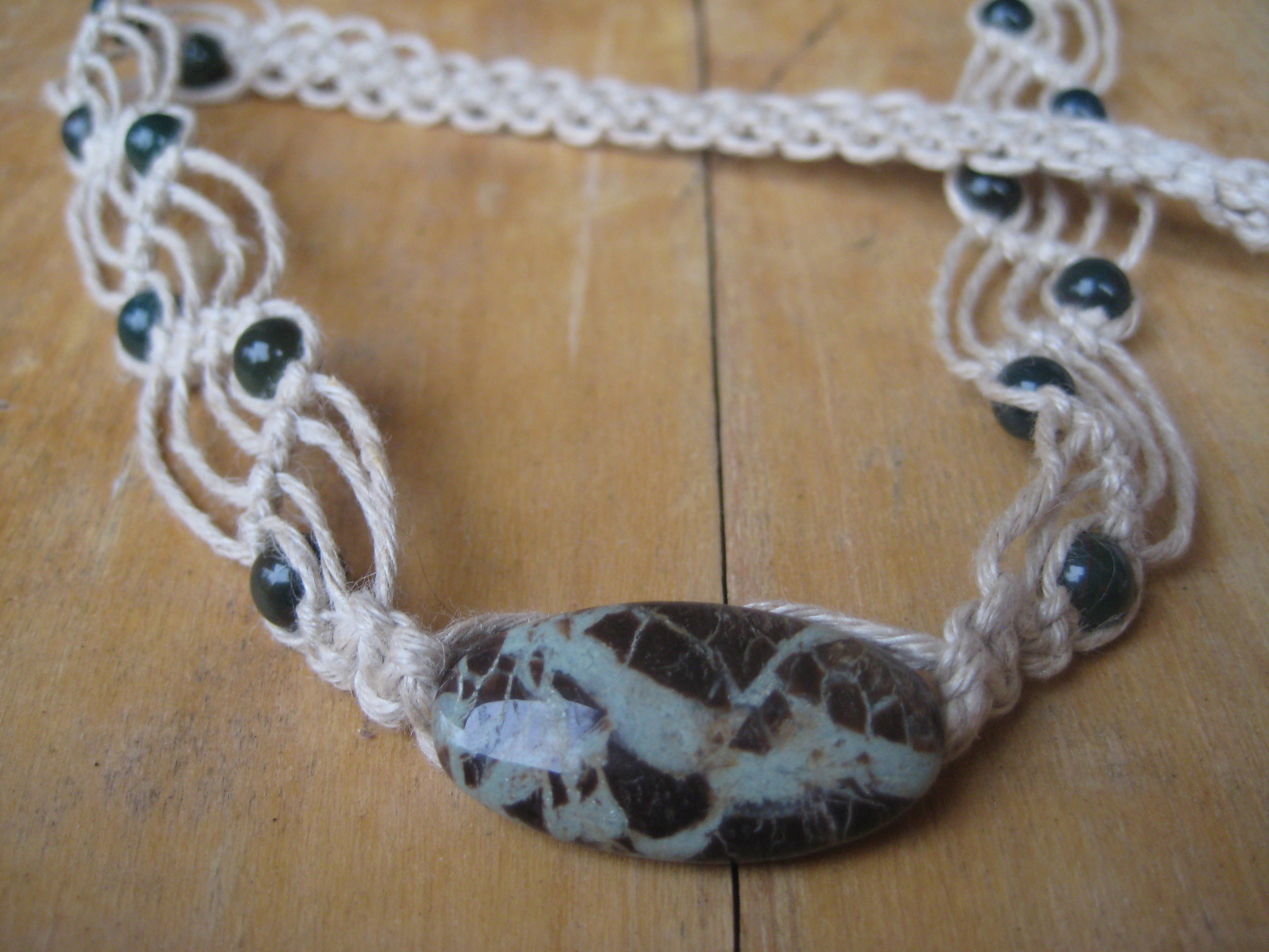 Gorgeous Lake Agate is the focal of this soft, comfy chemical-free hemp necklace. Bloodstone rounds dot the waves. This is a one-of-a-kind piece (that has a coordinating bracelet!) that will be on sale with more macramé soon at www.peridotdaisy.com!