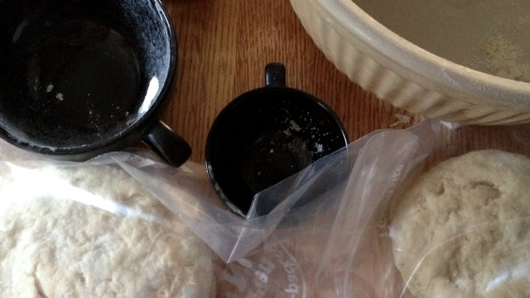 empanada dough resting; flour and measuring cups everywhere