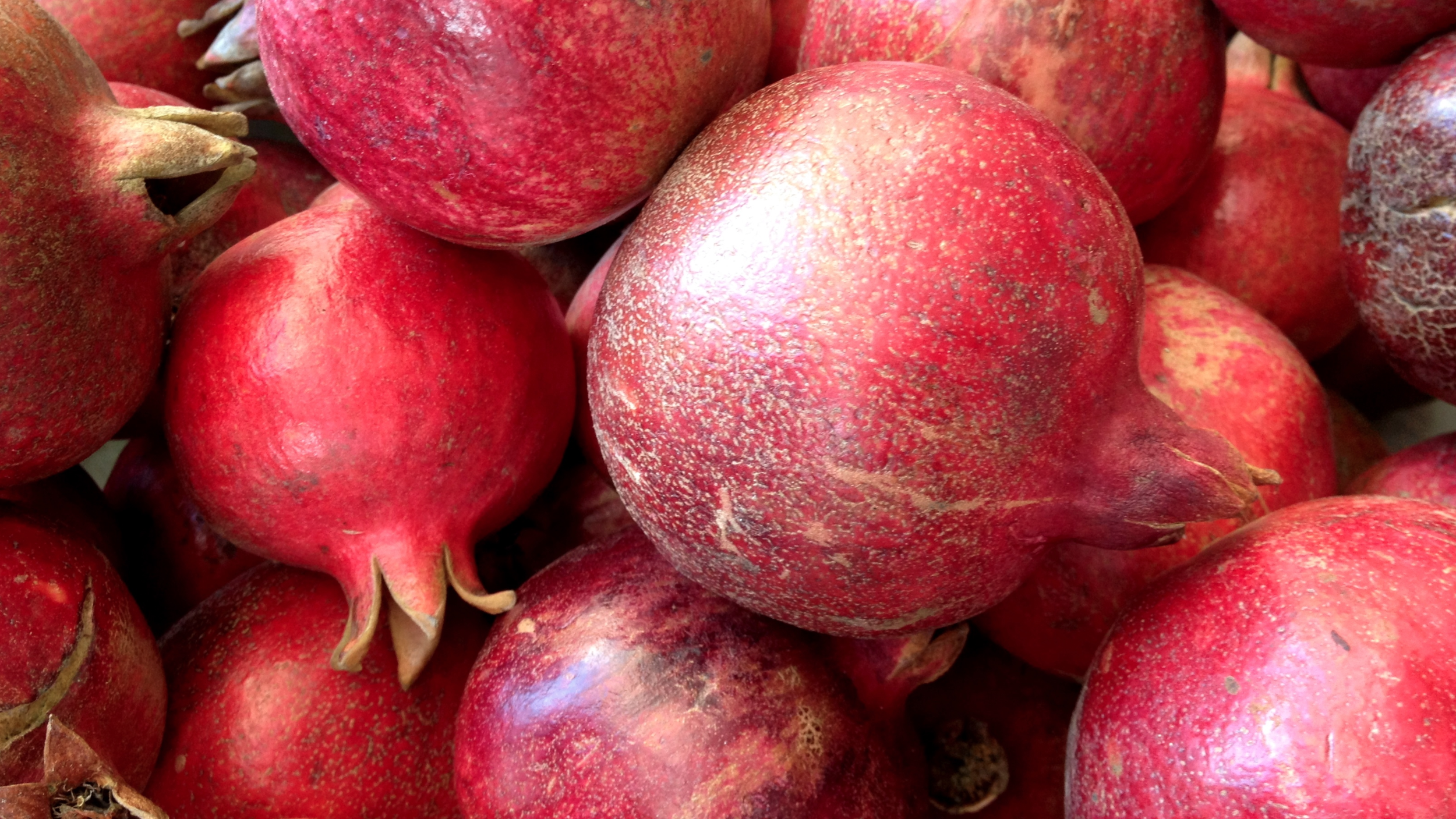 "pomegranate" comes from the Latin "malum granatum," or "seeded apple"