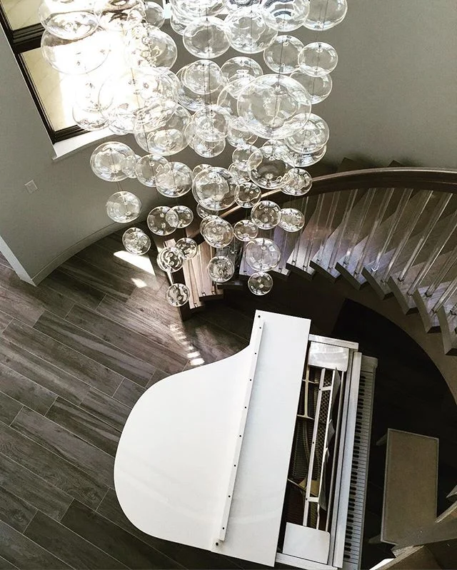 A view from above. #foyer #spiralstaircase #lucitespindles #bubblecrystals #makeityours #loveourclients #interiordesign @lightingpalace For info email marilyn@lillylevydesigns.com