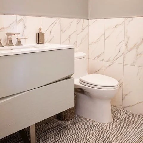 Architectural elements. #porcelainwalls  #marblemosaicfloor #lacquervanity #interiordesign #powderroom #makeityours #shadesofgrey #loveourclients  @focalpointhardware @decorplanetgallery  For info email Marilyn@lillylevydesigns.com