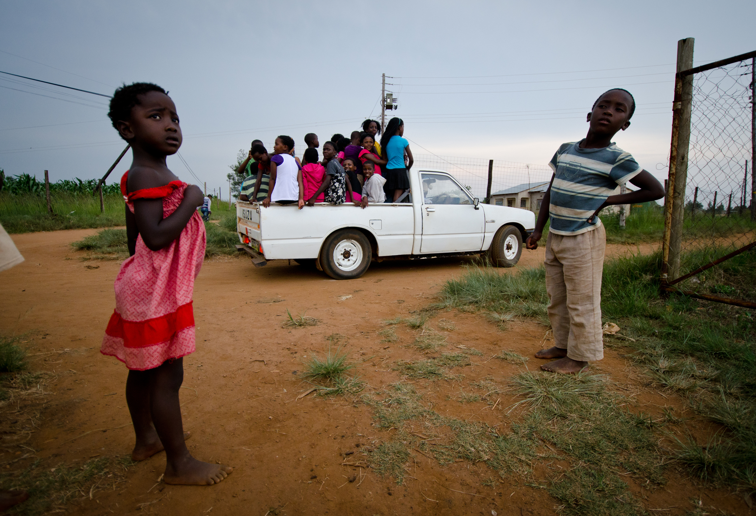  Children in rural Swaziland catch a ride home from Bible club in the back of a pickup truck.&nbsp; 