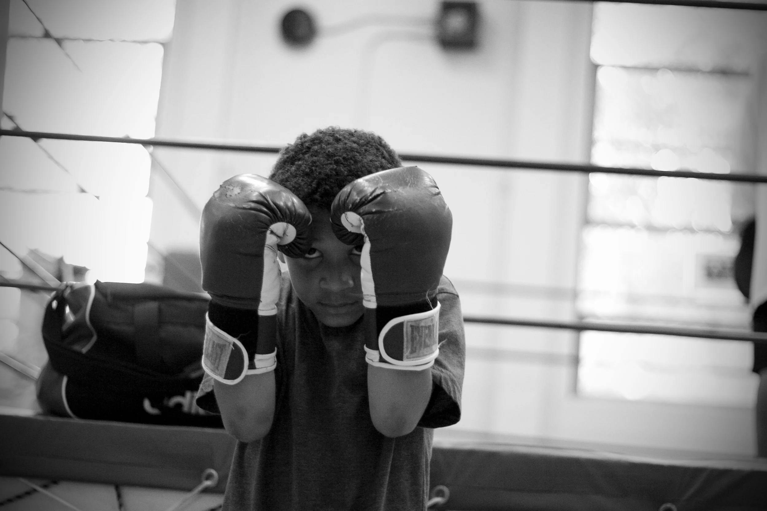  ​Zion Evans, 7, squares off with a punching bag in northeast Portland. Boxers may begin training young, but can't fight until they turn 8. For Zion, that is still five months away.&nbsp; 