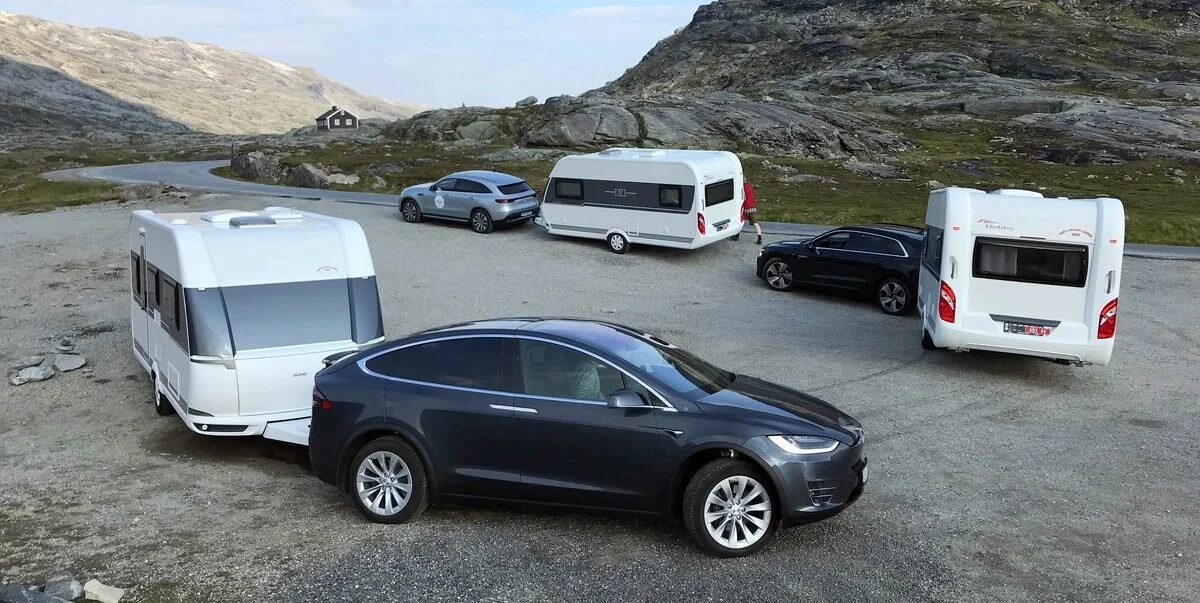 Three Electric SUVs Towing Campers through Norway