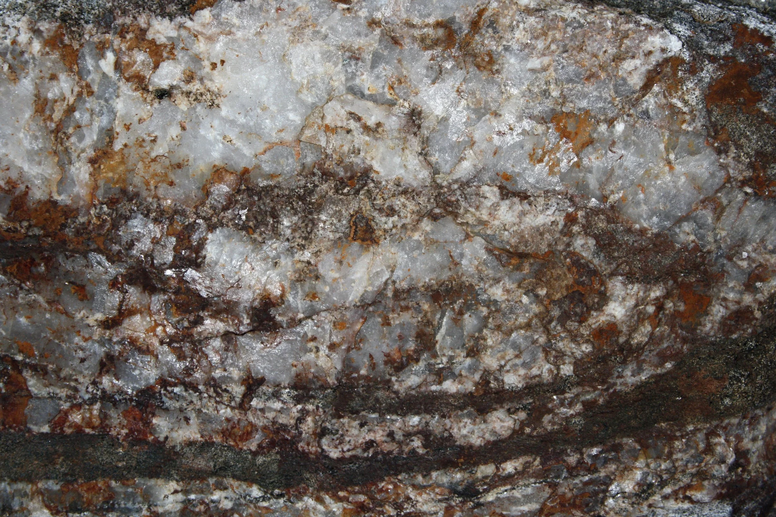 white-quartz-rock-texture-with-hematite-iron-rust-stains.jpg