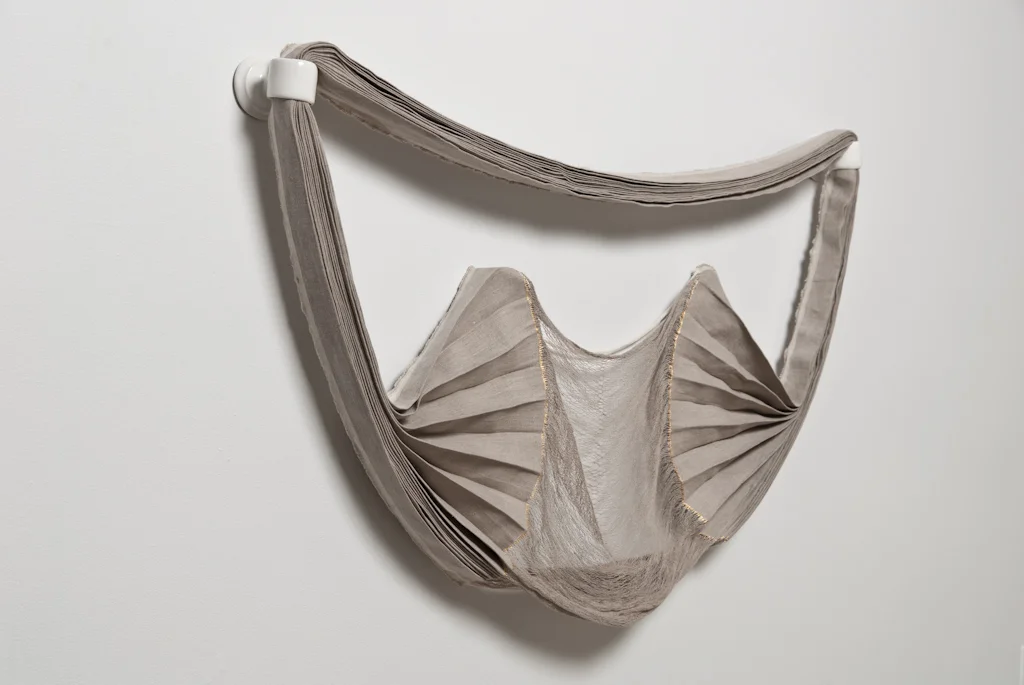 but a weak smile , 2012, commercial painter's linen, weft partially removed - remaining warp spranged, gesso, gold leaf, unique handbuilt porcelain stanchion hardware