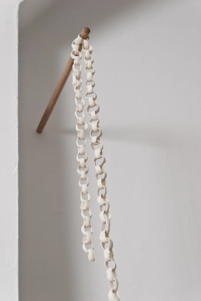 the accent of the lookout, the lookout's accent (detail) , 2012, porcelain chain, maple dowelling