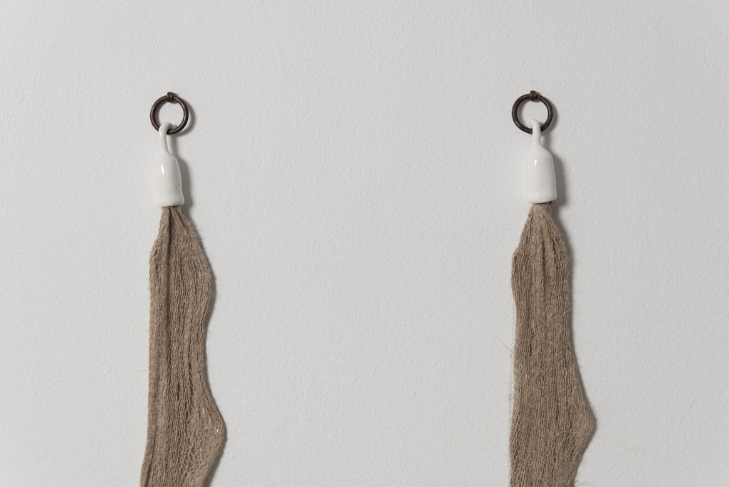 stanchions for E.H. (Immanent Collapse) , 2012, spranged linen, gesso, acrylic colour, iron rings, unique porcelain stanchion hardware