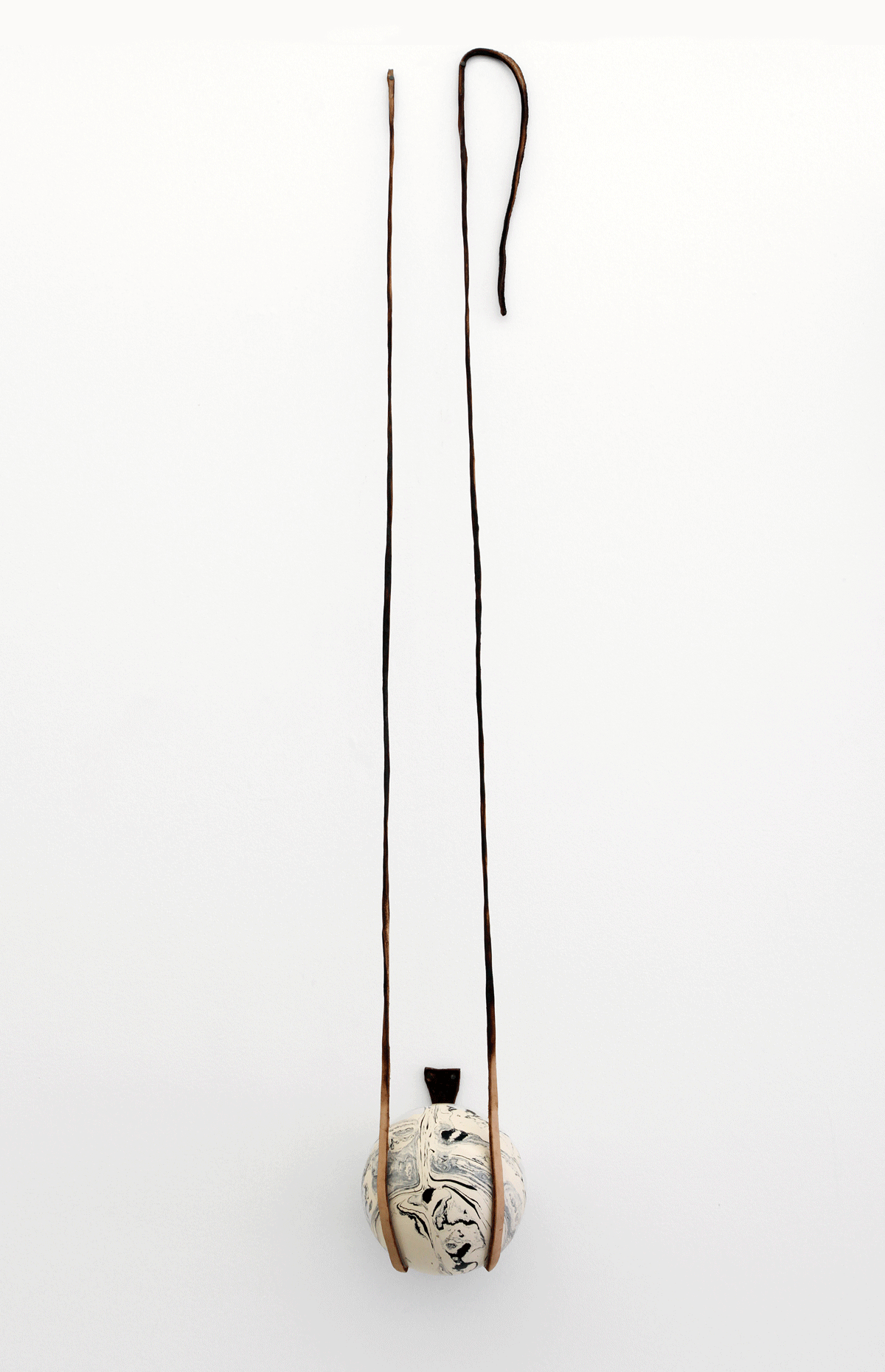 RODE HARD, PUT AWAY WET , 2013, boiled leather, found object, 40" x 5 ½" x 5 ½”