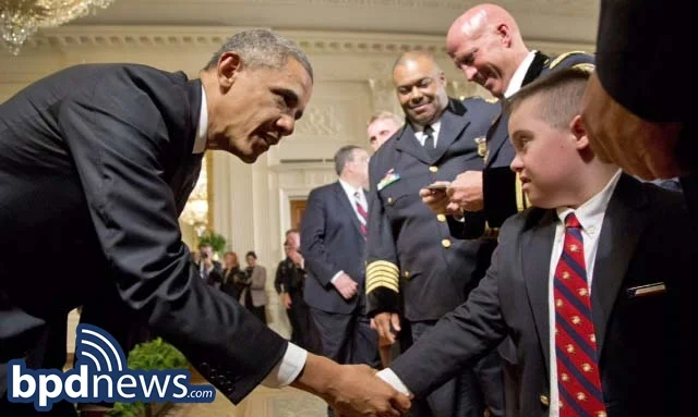 President Obama shakes hands with Brayden Gero, the son of Boston Police Officer Jarrod Gero during a ceremony to honor the nation's top cops.