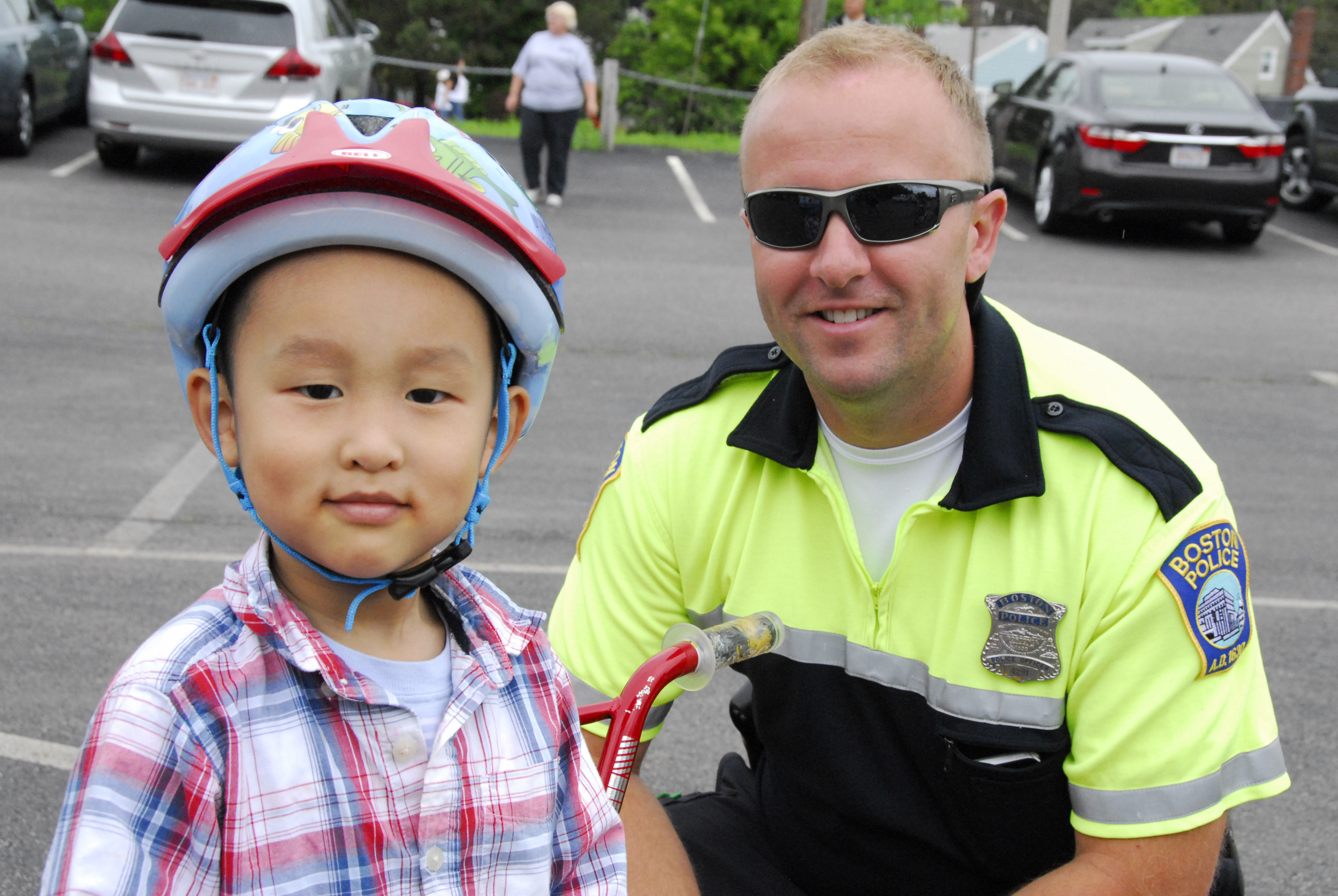 Officer Dario Fancelli hanging with one of his new friends at the District C-11 Bike Rodeo 