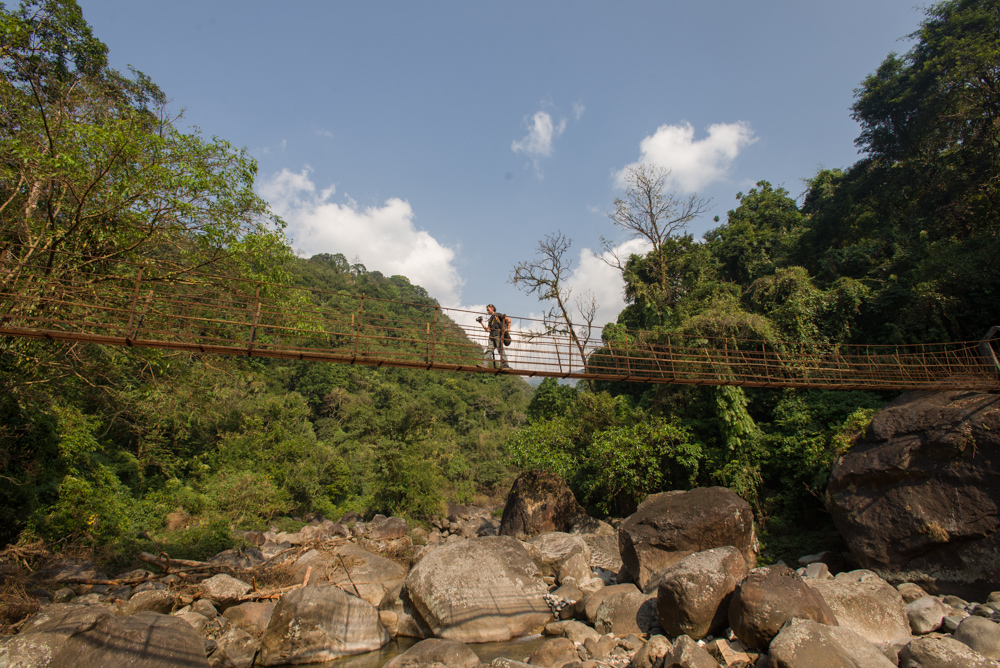 Man on suspension bridge