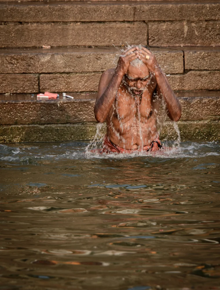 A worshipper bathing in the Ganges.