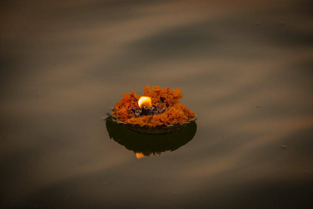 Lit candle on the ganges