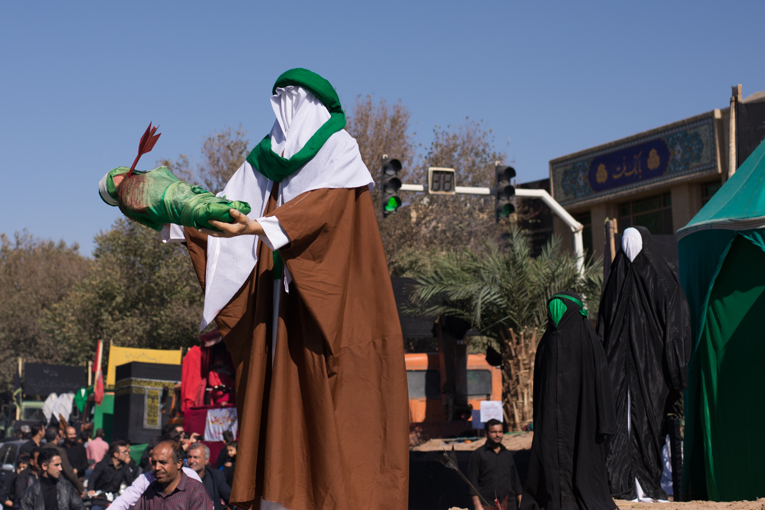 A parade float in Esphahan depicting the slaying of Hussein's infant son during the battle Karbala in AD 680.