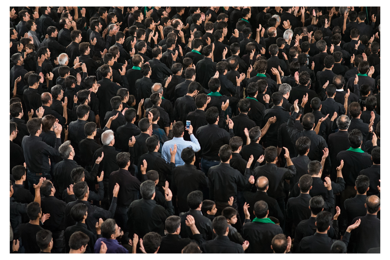 man-with-phone-in-a-crowd.jpg