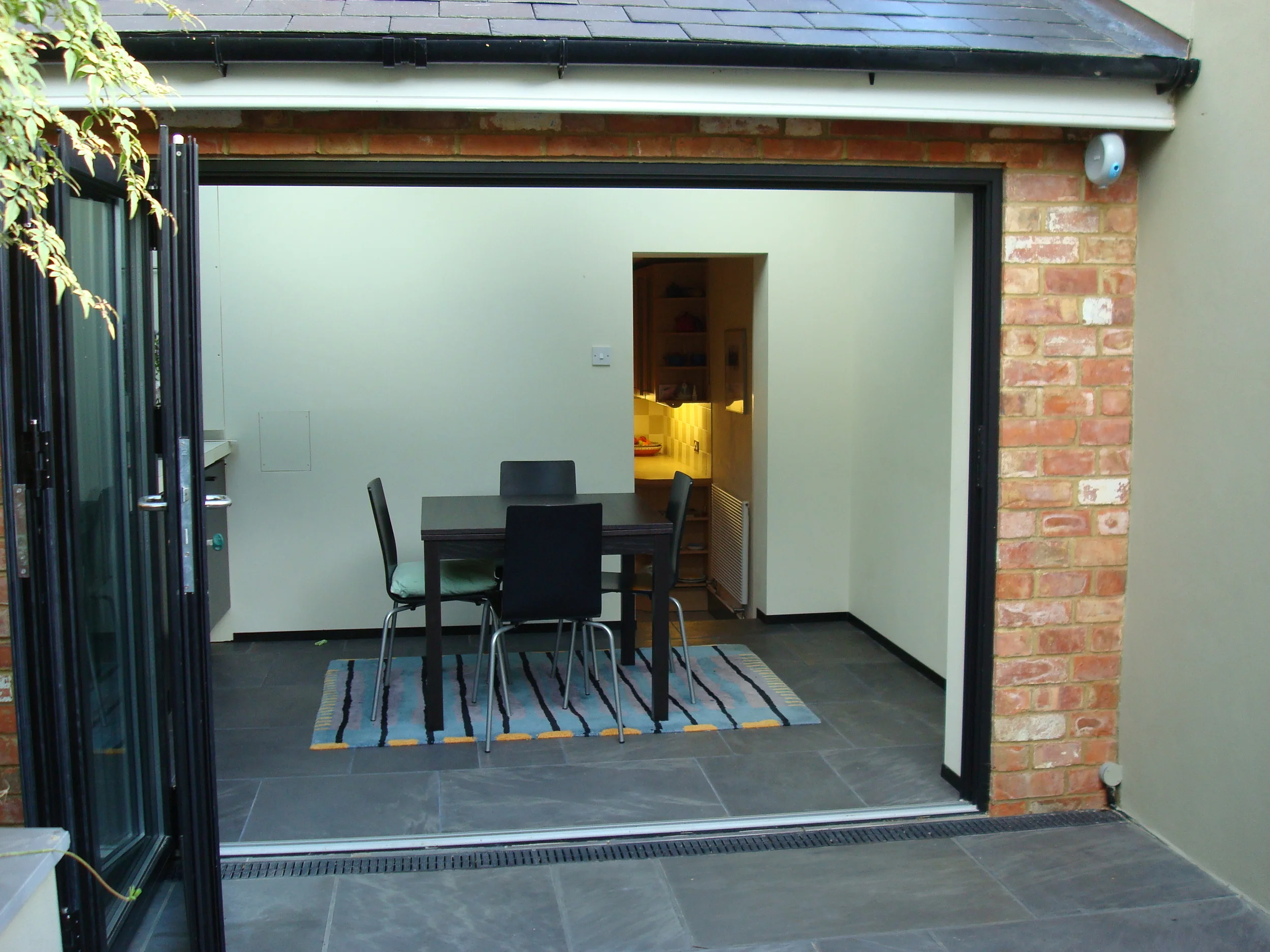  Concertina doors were installed to open up the inside to the outside. 