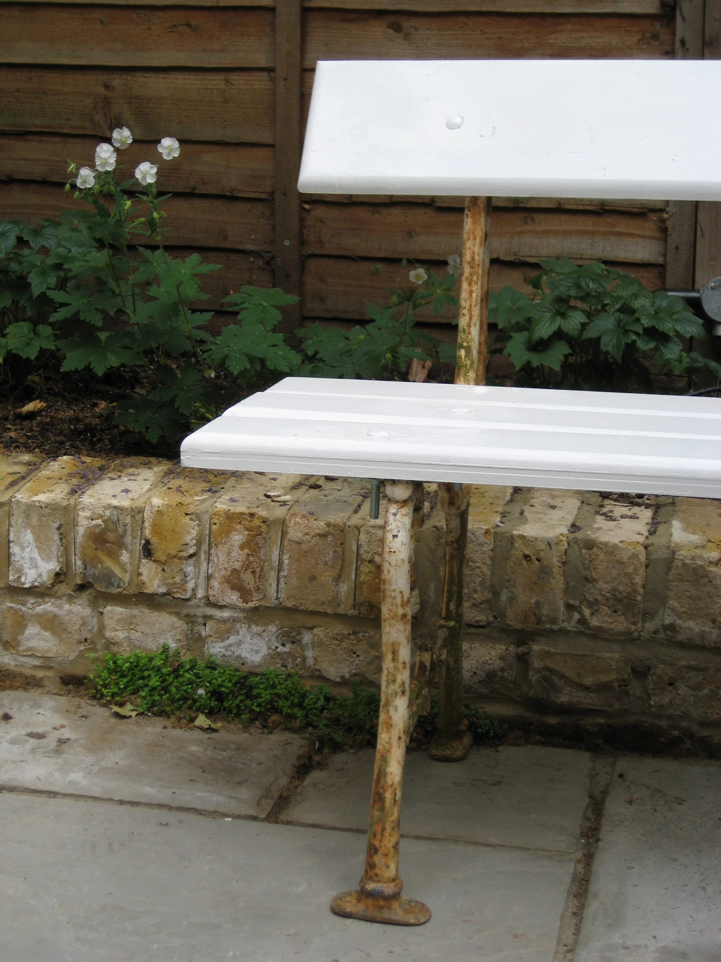 A table and chairs (below) and bench (above) were sourced from a French Reclamation yard.