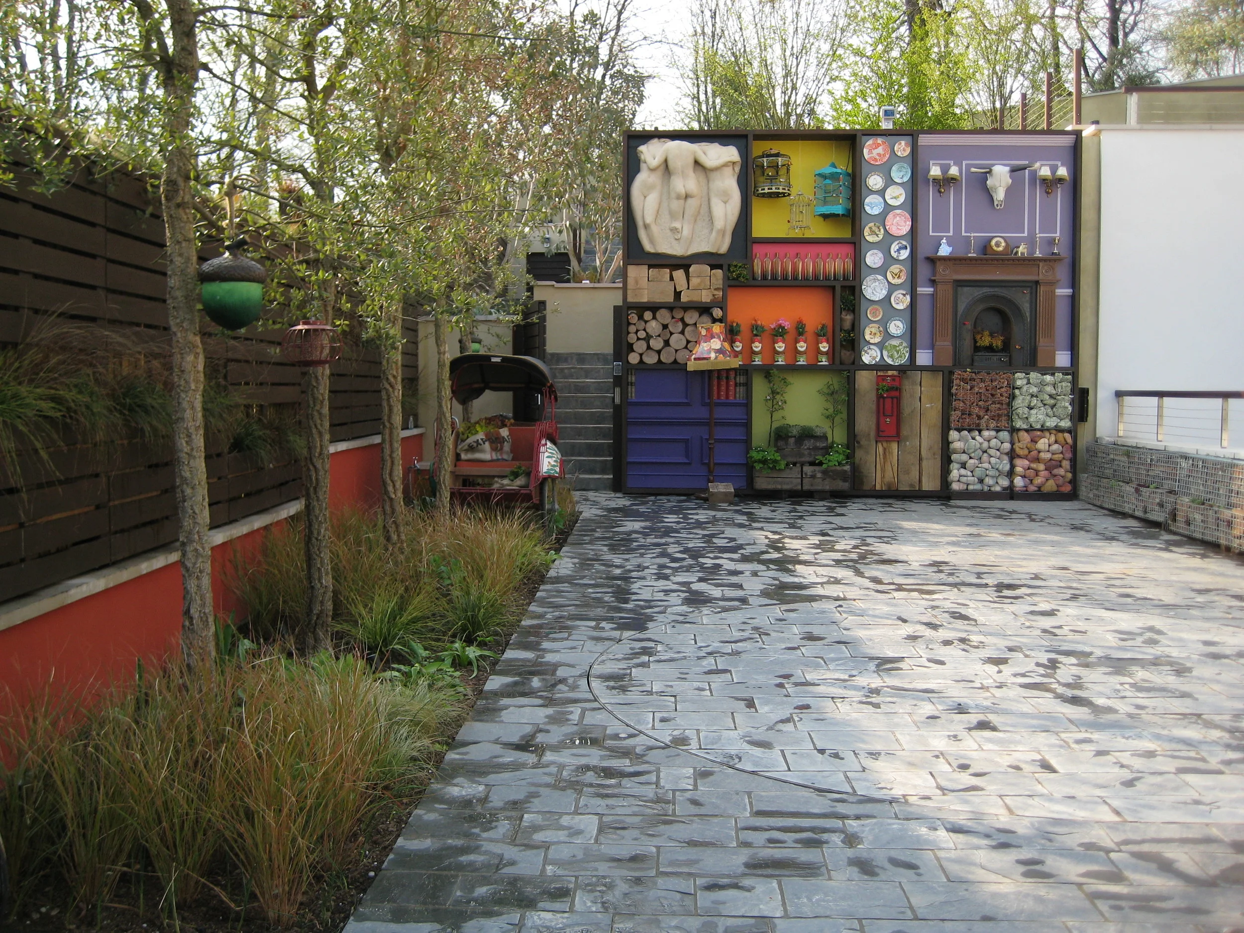 Finishing touches to the garden included this feature wall that reflects the eclectic taste of the owner. 