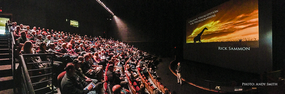 That's me at the Denver IMAX. My books are on stage at the bottom right of the photo.
