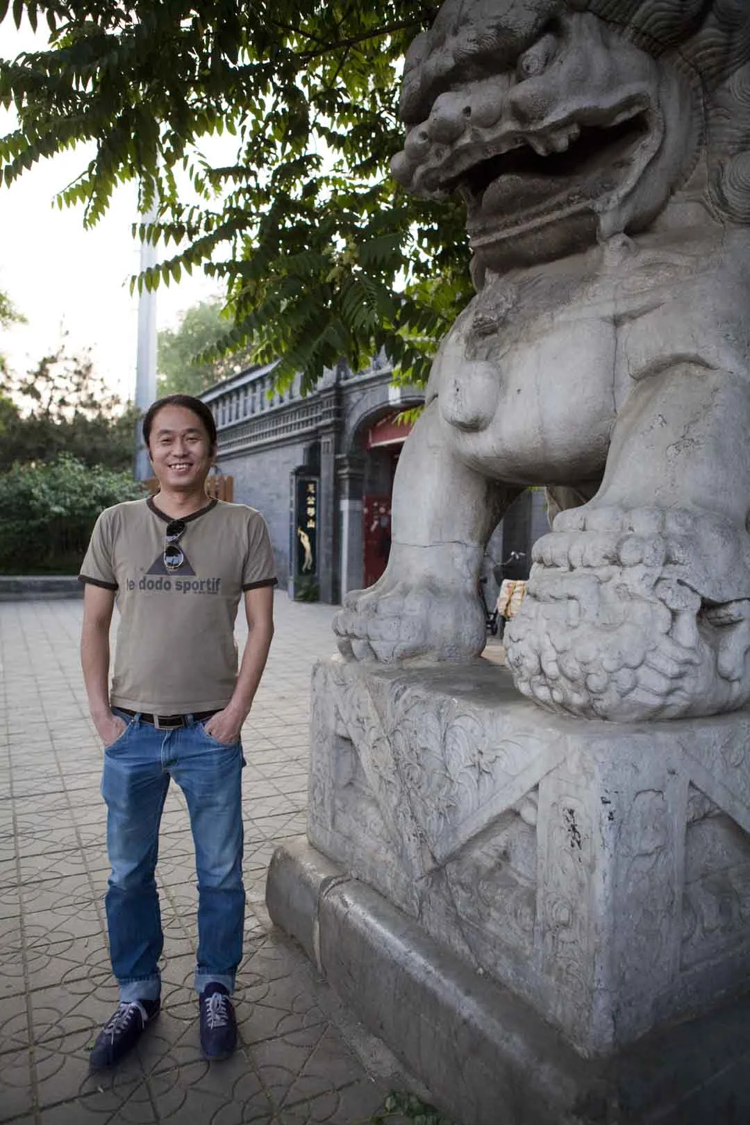  Lue Zhiqiang, aka Gouzi, owner of legendary Beijing livehouse Yugong Yishan, photographed in front of the venue in 2012 for City Weekend. 