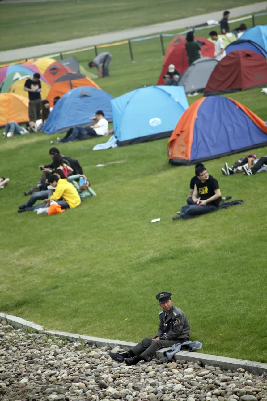  A security guard takes a break at the 2012 MIDI electronic music festival. 