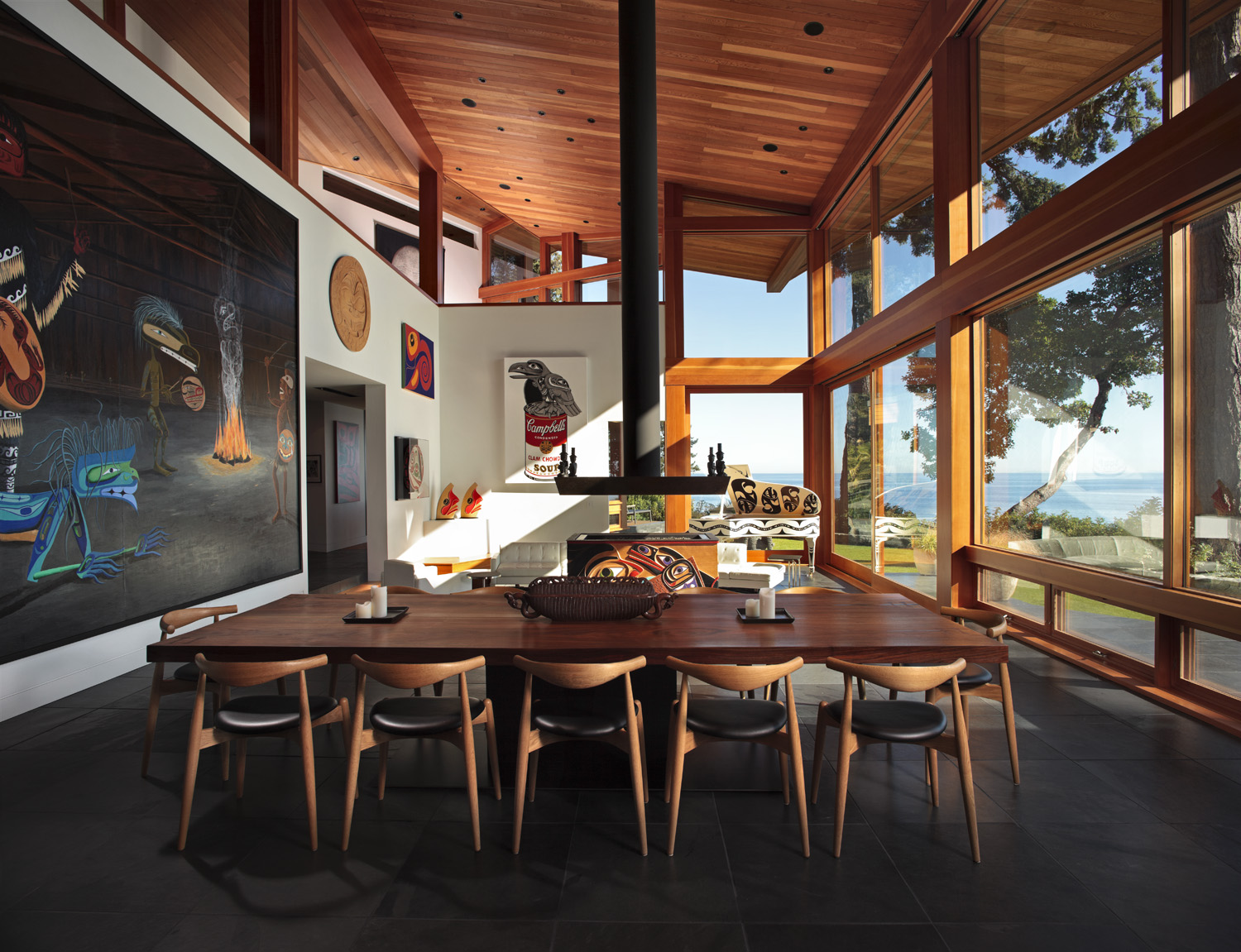 The interiors are designed to connect the interior to the exterior. Large columns support large expanses of roof to mimic the trees and their horizontal canopies, slate walls carry through the house from interior to exterior and back out again, and water flows from a man made creek up and around the house. 
