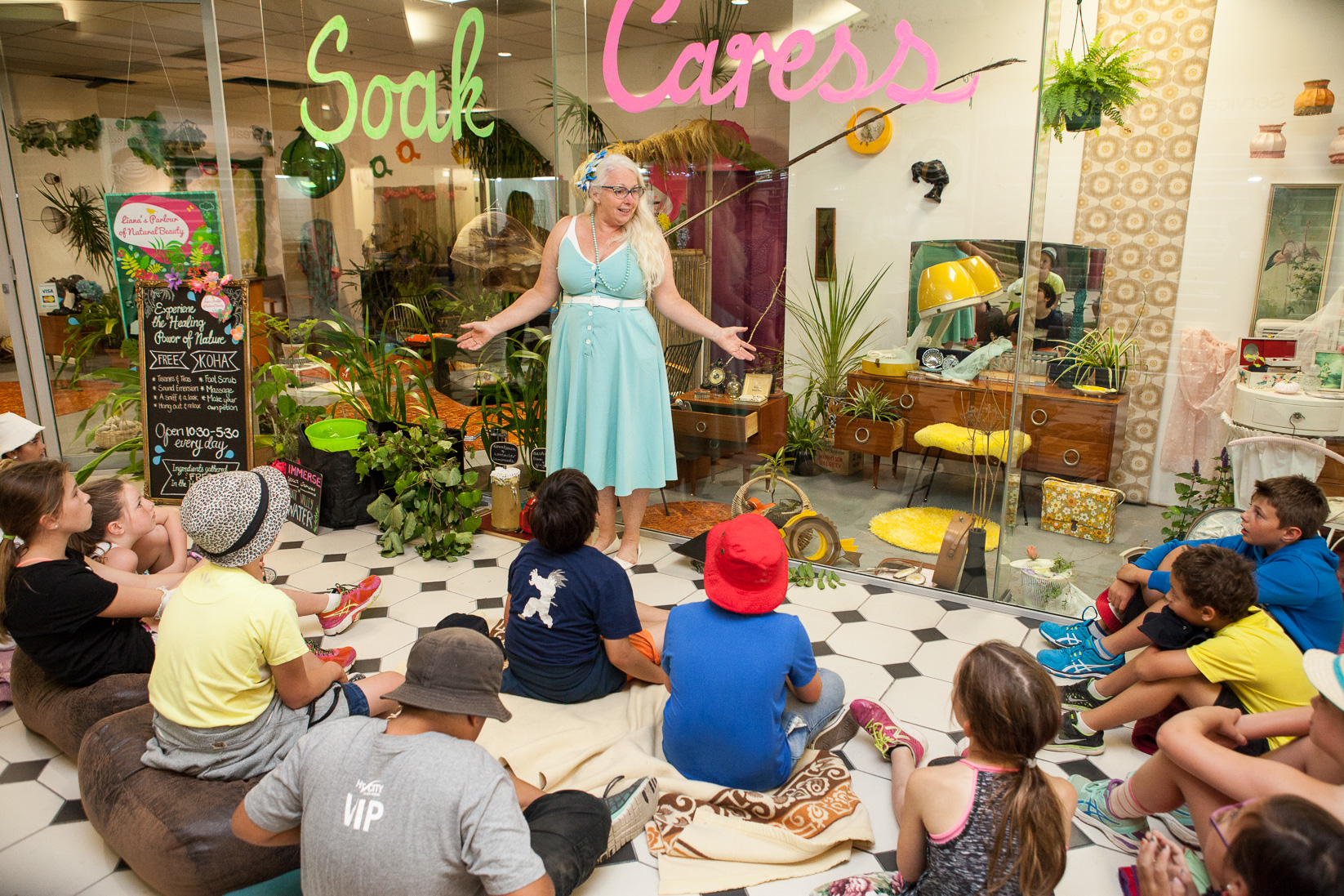 Children engage with Liana’s Parlour of Natural Beauty, a recent project by Liana Stupples in Lower Hutt which brought all the natural goodness of the surrounding environment into a vacant retail space. Image: Dionne Ward