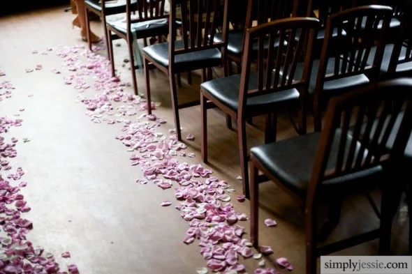 Rose petals down aisle