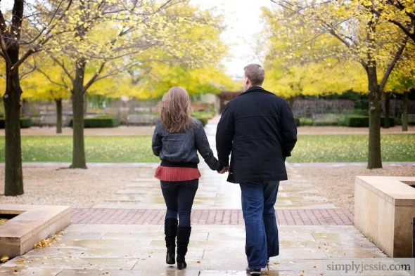 Engaged couple walking in Fall color