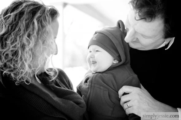 Family laughing with baby
