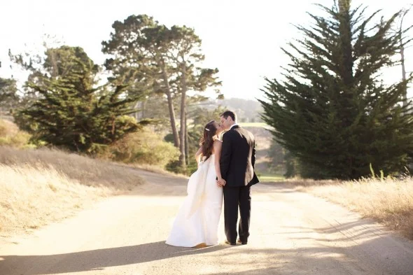 Bride and Groom walking down country road