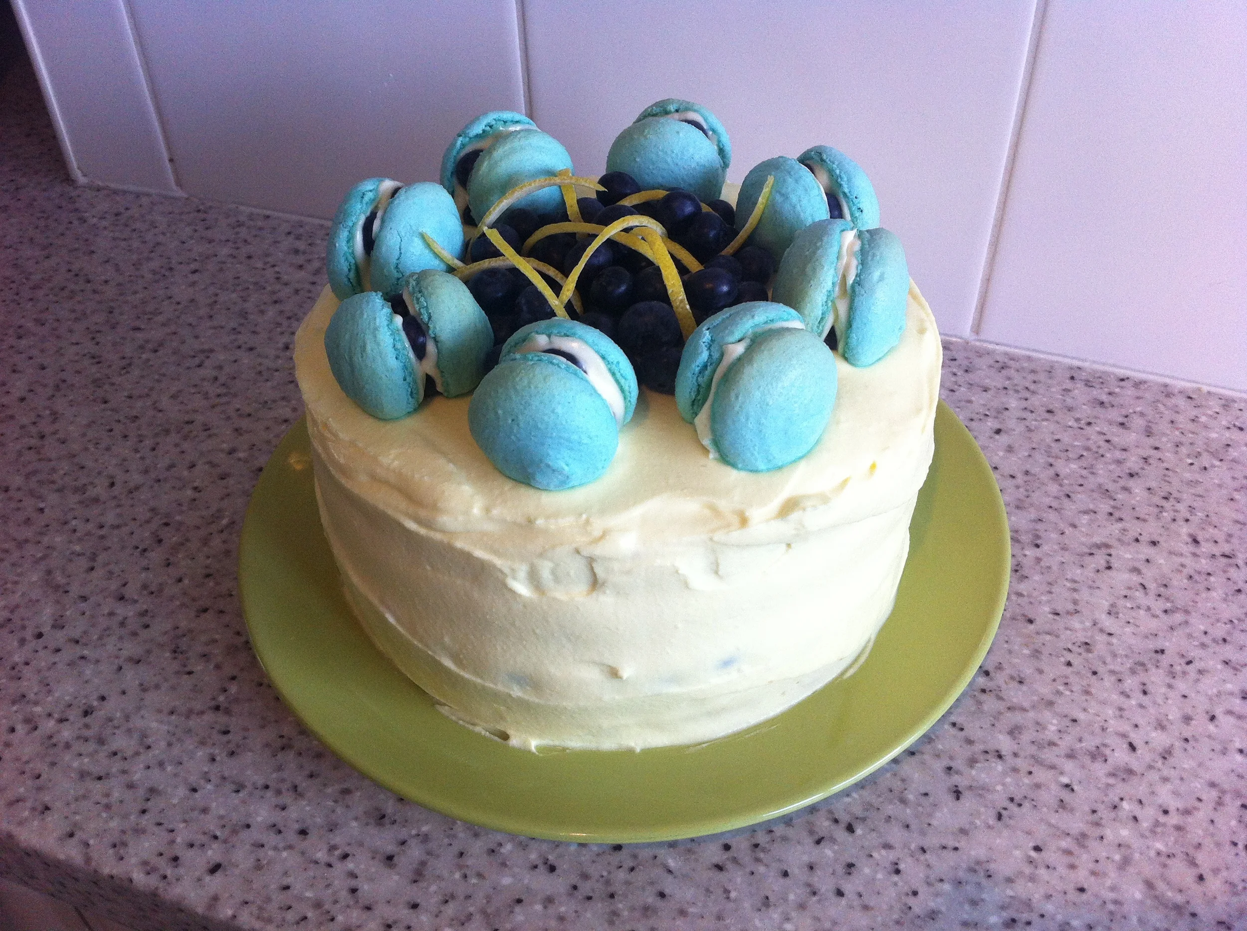 Lemon and blueberry layer cake with blueberry cheesecake macarons