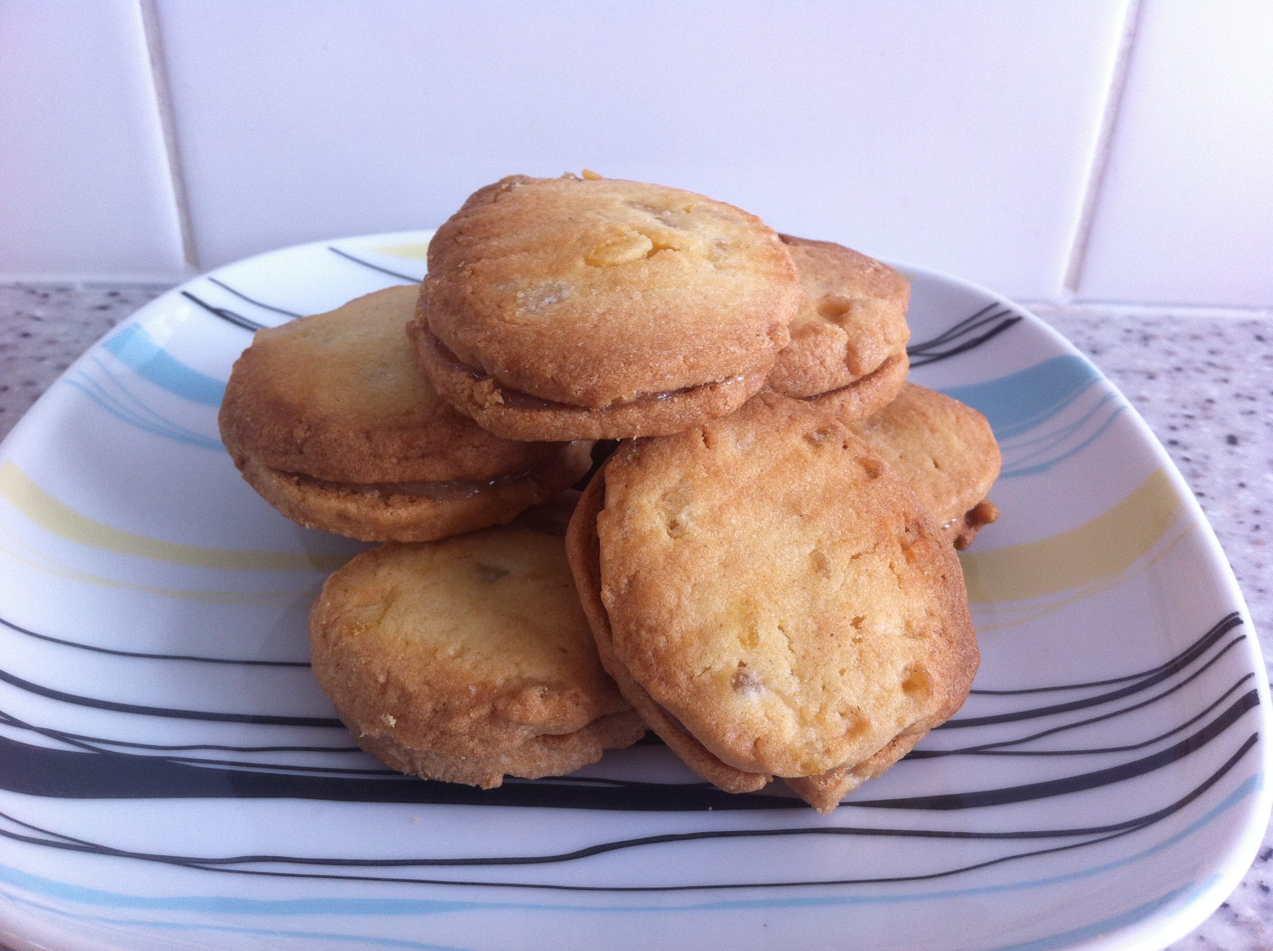 Biscuits with candied peel, sandwiched with lemon curd