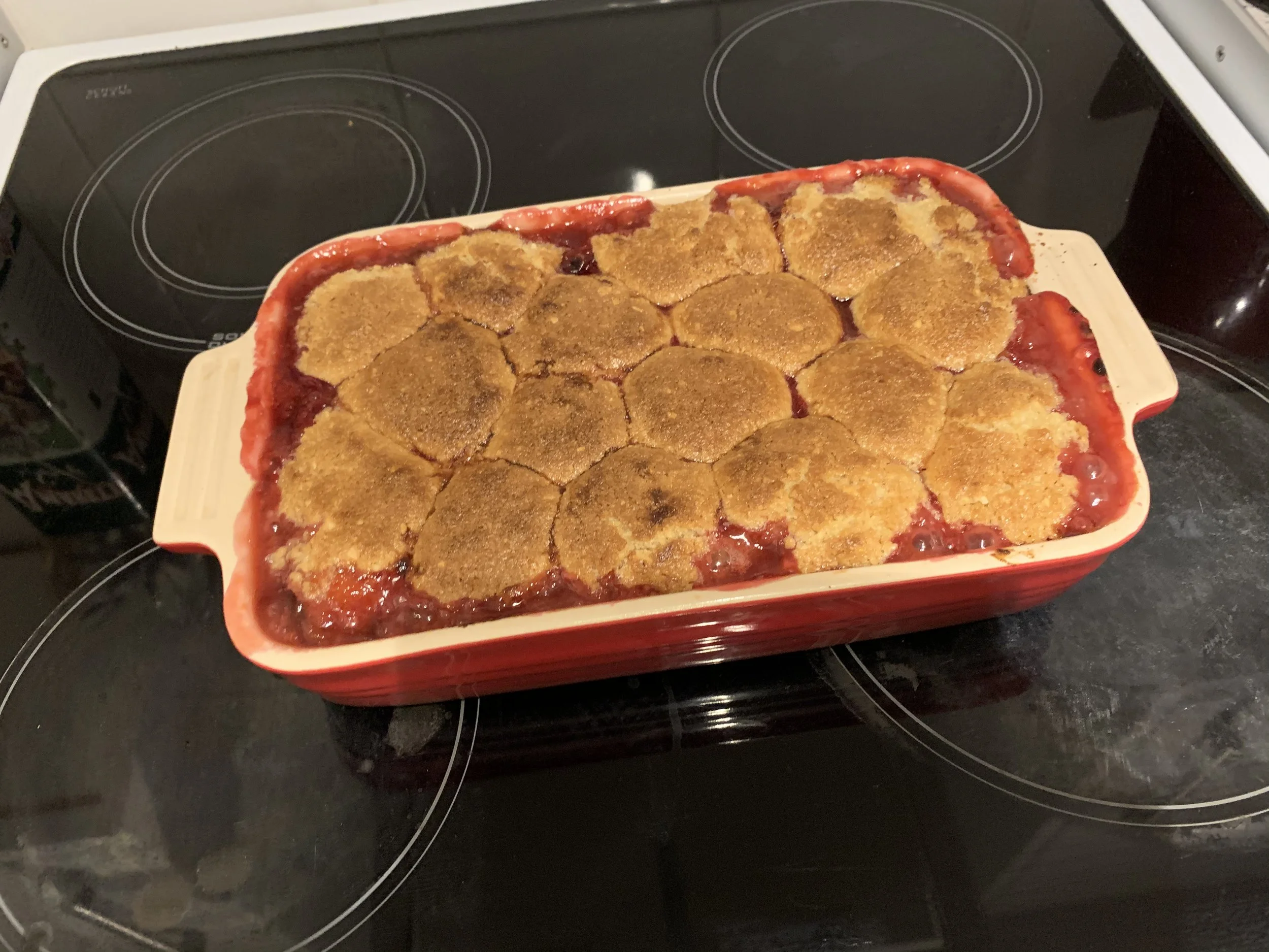 Plum, orange, and hazelnut cobbler
