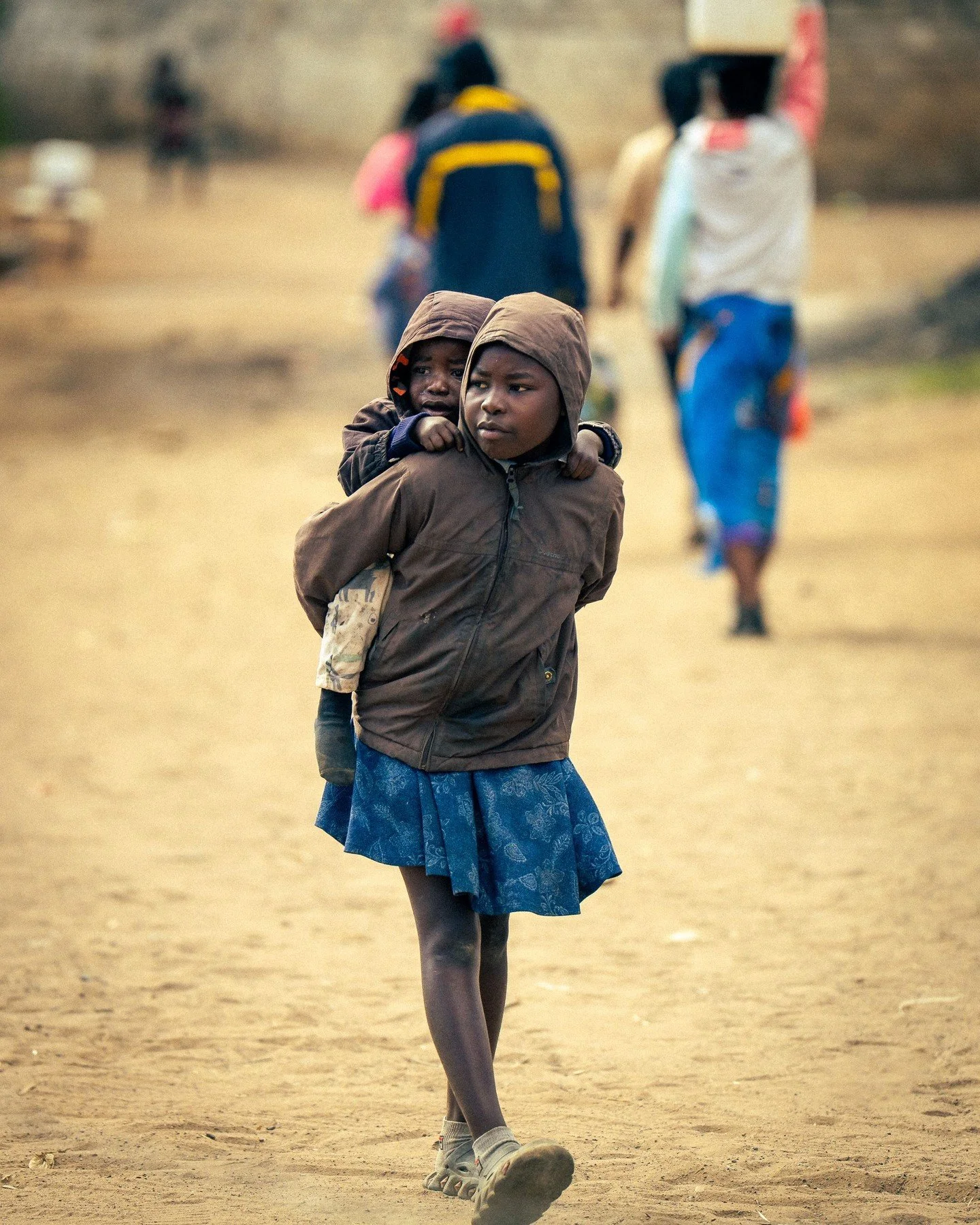 Street scene from a commune in Lusaka, Zambia, Africa. This seemed to be a fairly typical scene with  kids looking after kids. @africa #lusaka #streetphotography #wanderlust #travelphotography