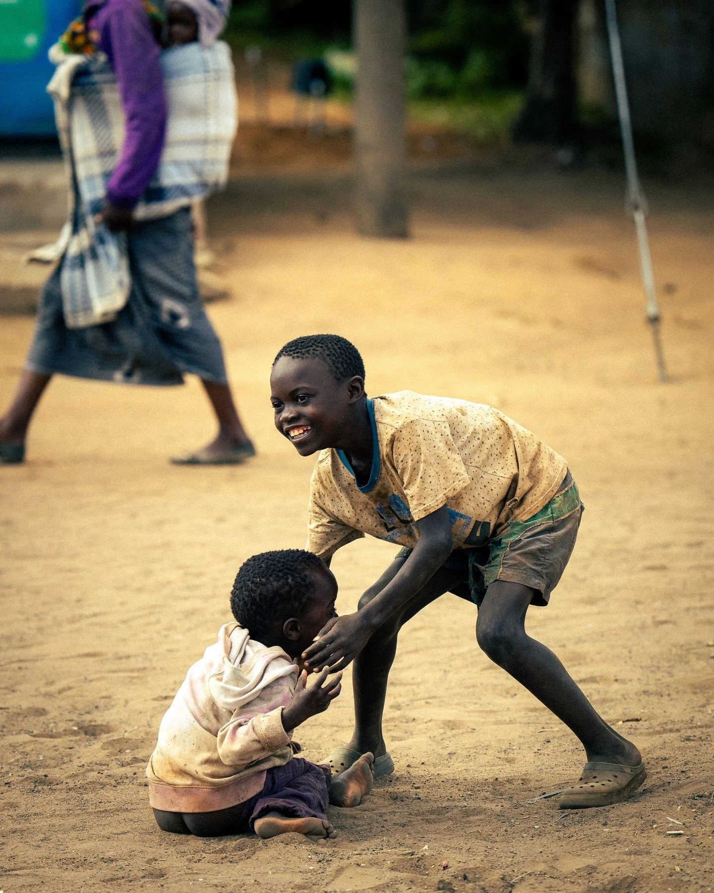 Street Photos - These guys were  playing around- or wrestling. But still all smiles. Village near Lusaka, Zambia #streetportrait #streetphotography #streetphoto #portrait @africa