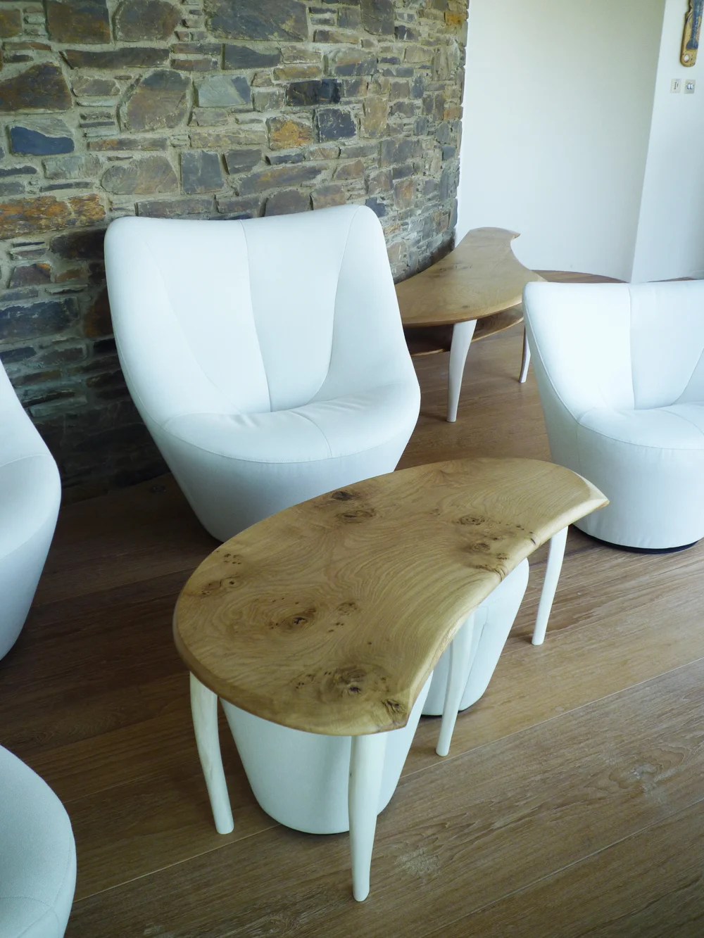 These tables created in character oak with bleached ash legs.