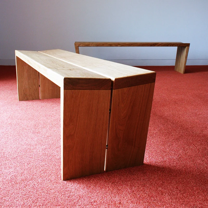 B5 bench - end view showing the gap set form and inclined seat planes that adds comfort to the seating