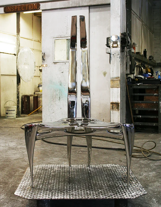 Hammerhead RVS chair during final polishing stages at the foundry