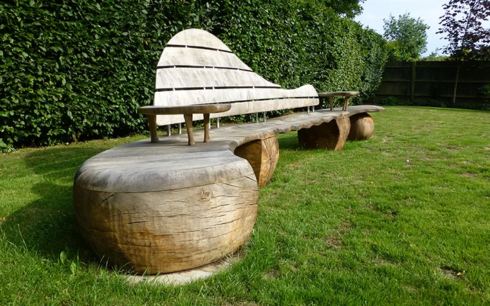 Although sometimes surface checking can appear on larger bulk carved sections - it does not deter from the structural longevity of the wood.
