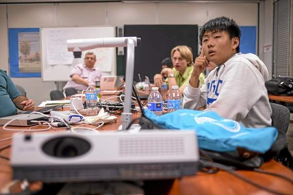 Isaac Kim, right, and other members of North Hollywood High’s CyberPatriot team prepare for their trip to Washington, D.C., to compete in the CyberPatriot VI Games. (Photo by David Crane/Los Angeles Daily News)