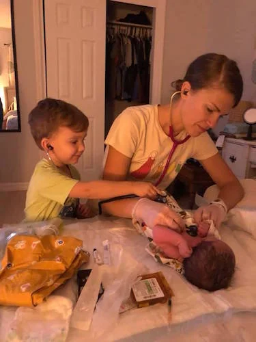 A complete newborn exam after a homebirth is done right in your bed, with your family as involved as you’d like them to be.