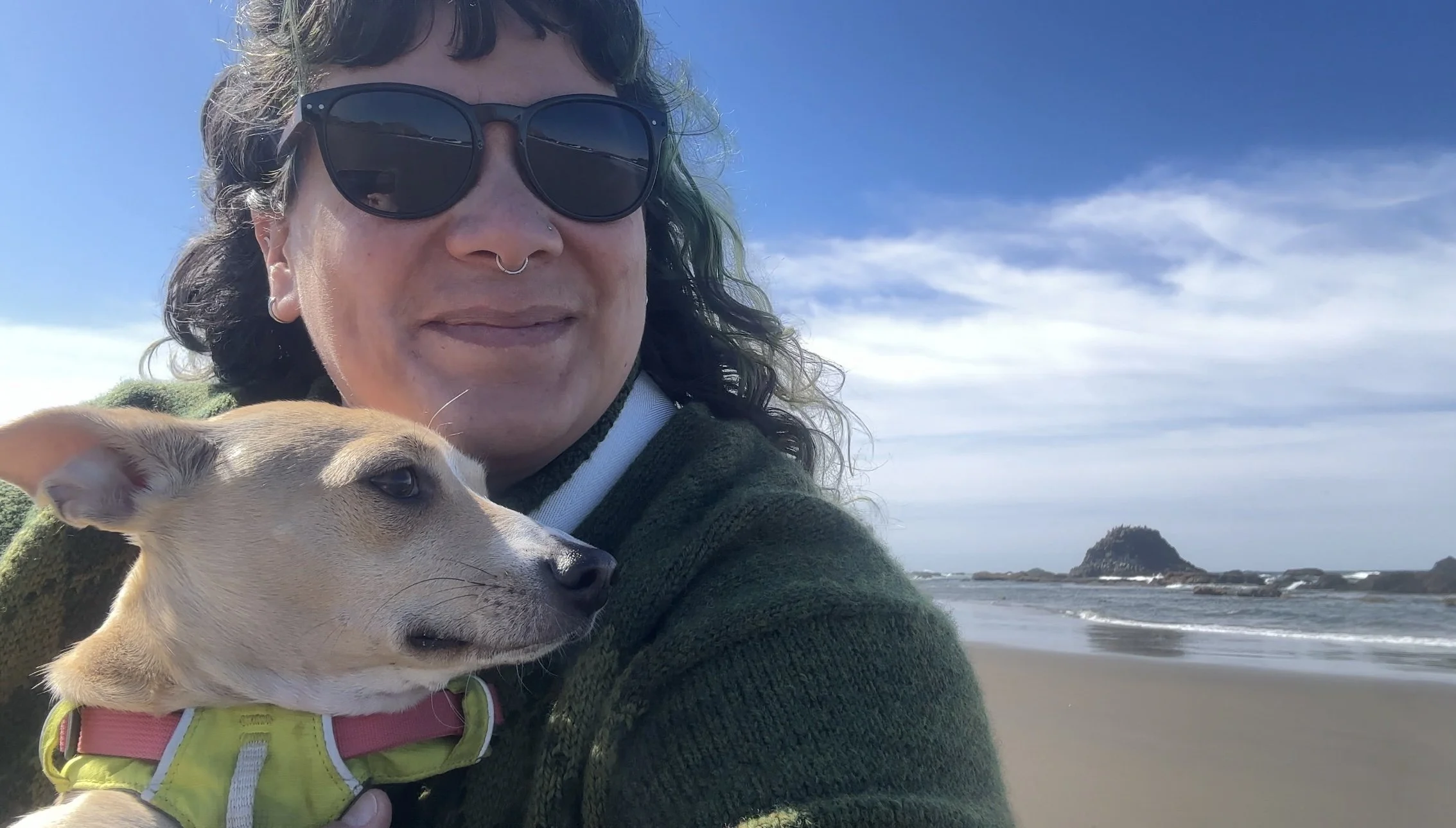 Daniella with her chihuahua on the beach