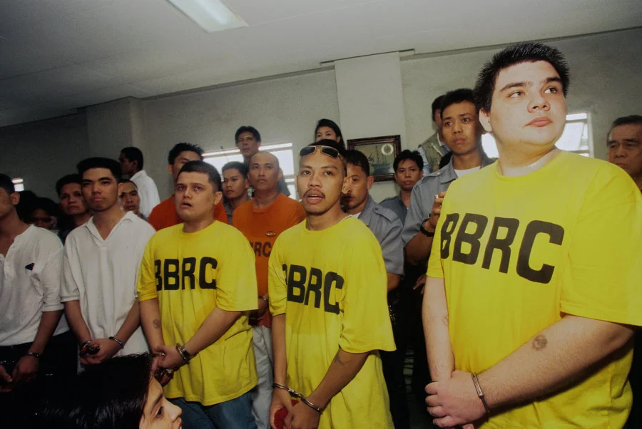 Paco Larrañaga (right), a culinary student from Cebu, Philippines, was arrested for the kidnap, rape and murder of Jacqueline and Marijoy Chiong. His ordeal was the subject of award-winning documentary "Give Up Tomorrow" by Marty Syjuco and Michael Collins. With co-accused Josman Aznar (left) and Rowen Adlawan. (Photo by Alex Badayos. Source: giveuptomorrow.com )