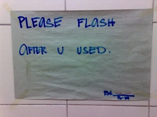 Sign displays: "Please flash after u used."