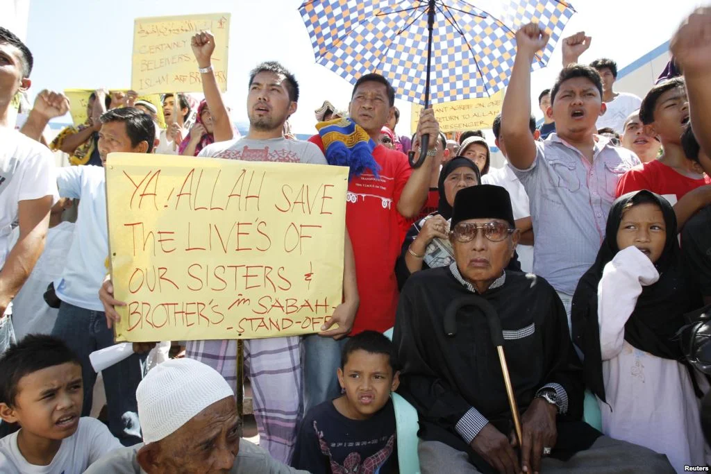 Outside the Blue Mosque in Taguig City, Philippines, Kiram and his followers stage a protest against the Malaysian police who fired upon his other followers who occupied a village in Sabah. (Reuters)